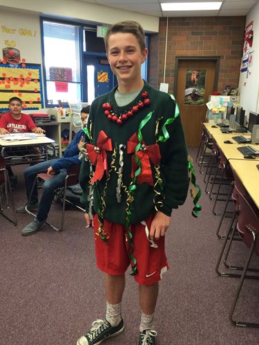 student wearing Christmas sweater